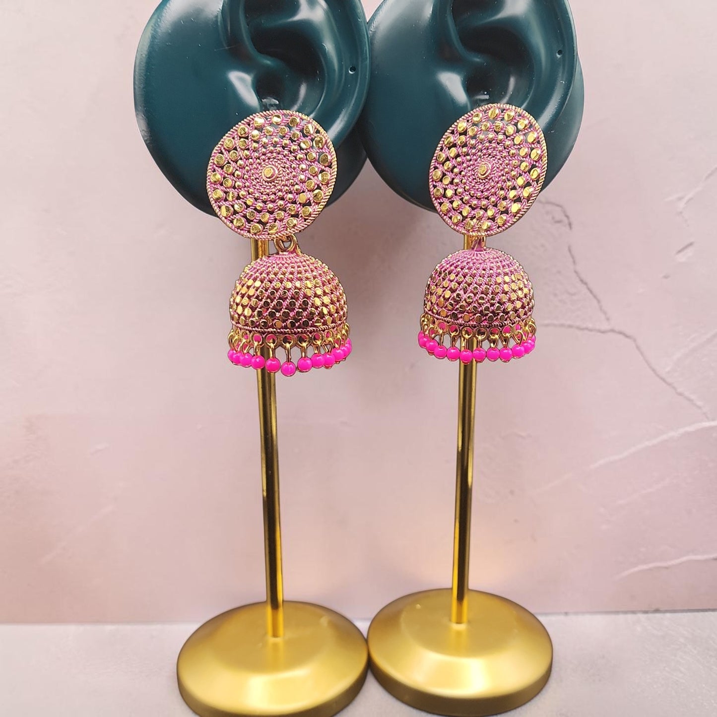 PSK ELEGANCE Gold Jhumka Earrings with Pink Bead Detailing