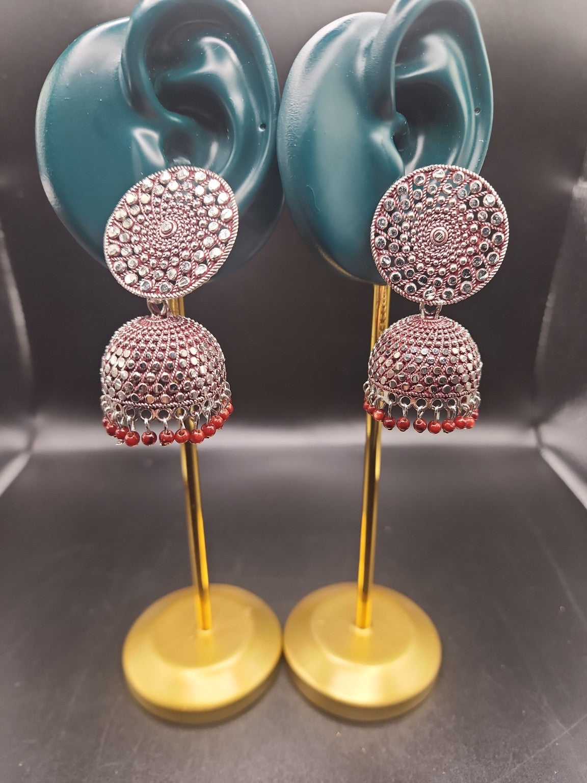 PSK ELEGANCE Silver Jhumka Earrings with Red Bead Detailing