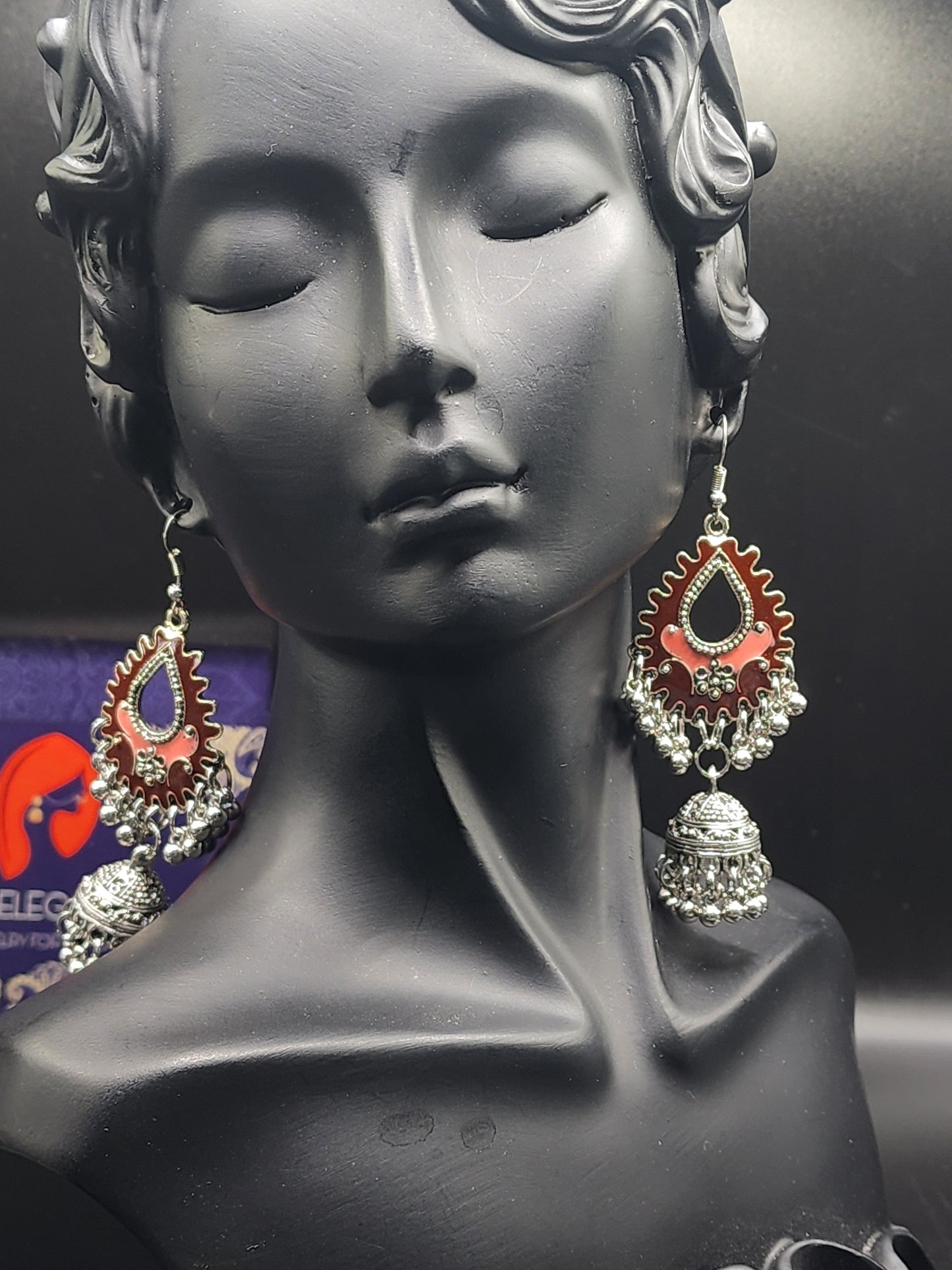Elegant silver dual-toned dangling earrings.
