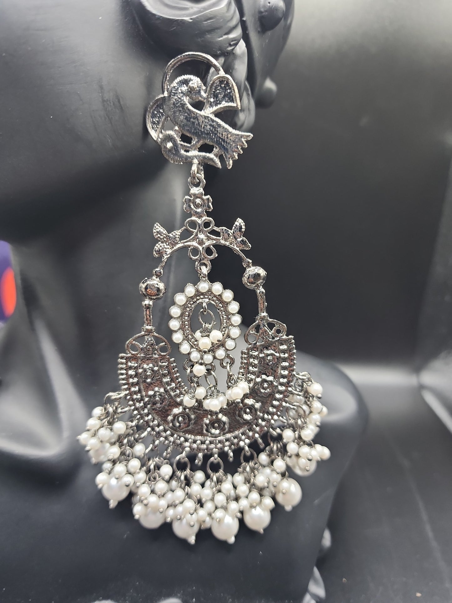 Intricate oxidized design Elegant pearl drop finishBold traditional + modern fusion