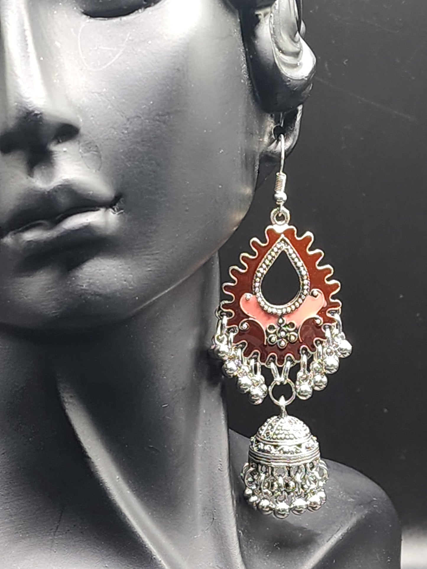Elegant silver dual-toned dangling earrings.