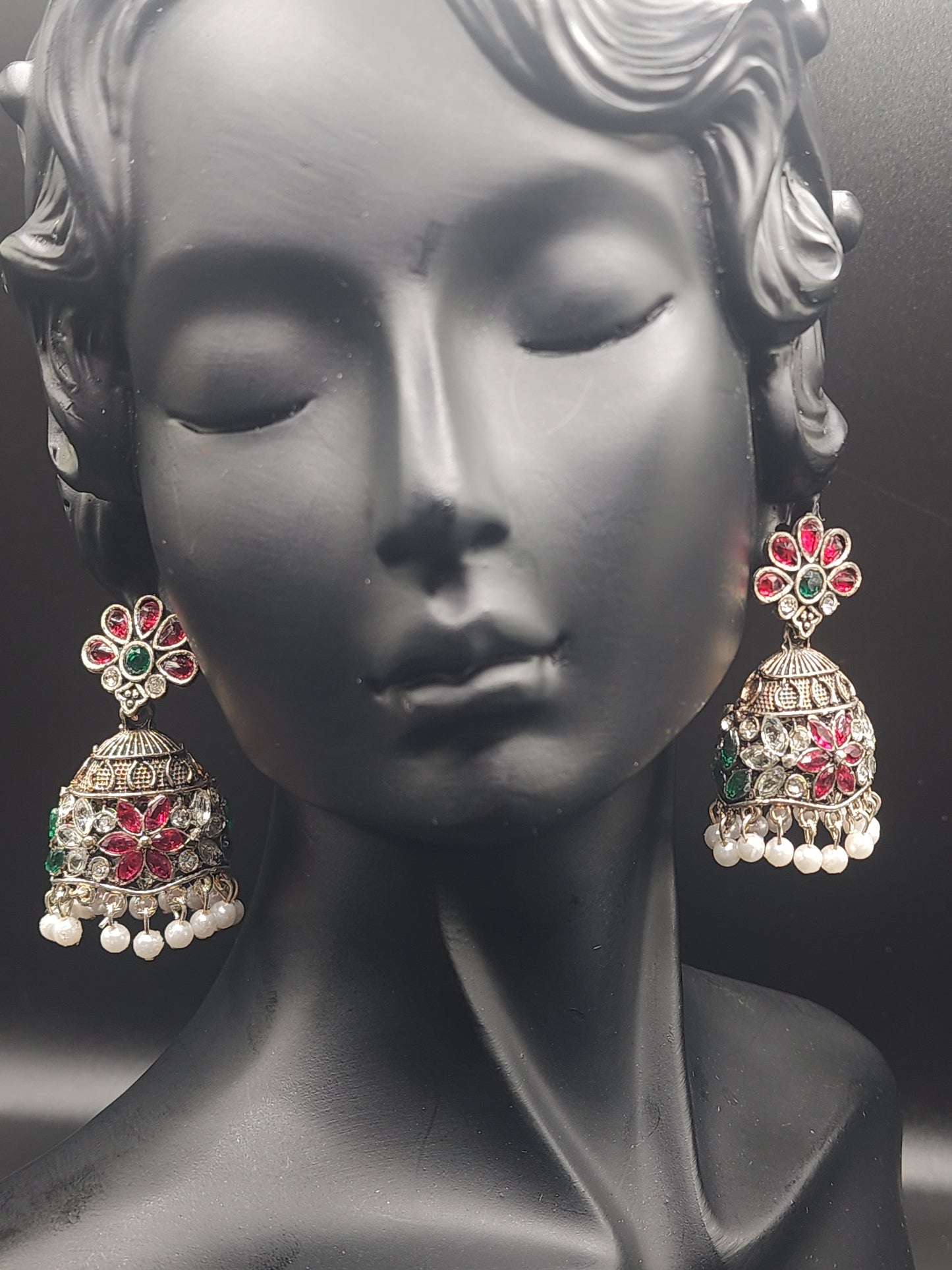 Handcrafted jhumkas featuring rich ruby tones, emerald accents, and delicate pearl drops ❤️