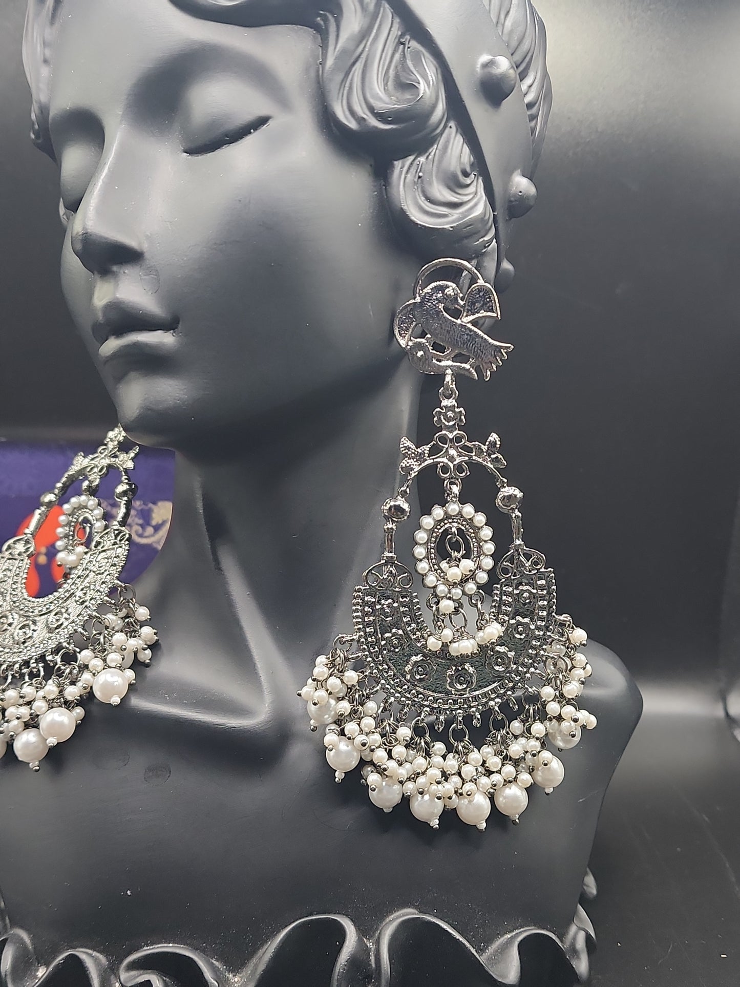 Intricate oxidized design Elegant pearl drop finishBold traditional + modern fusion