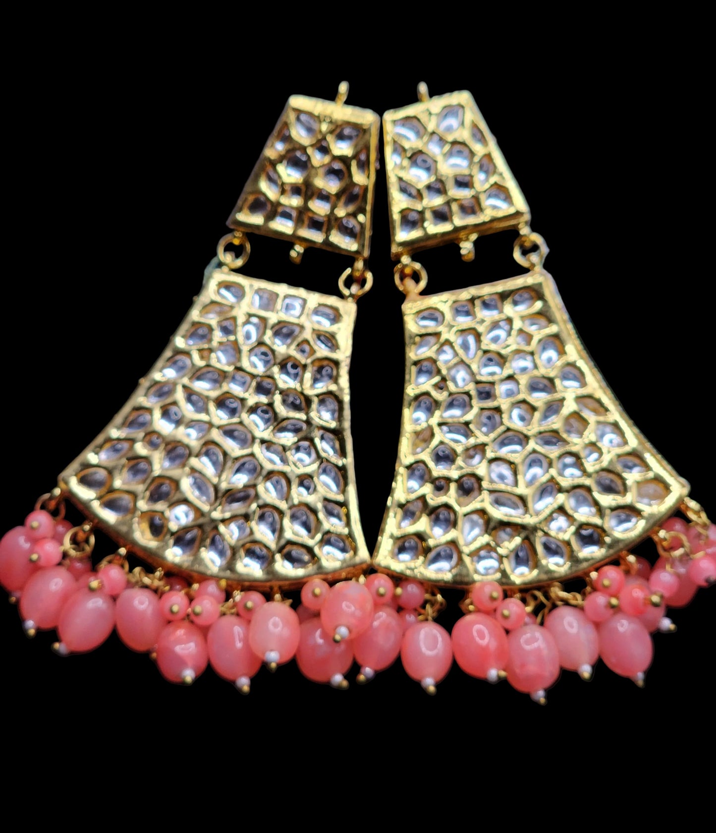 Bold, vibrant, and made to stand out. It's got rich enamel, intricate gold-tone work, and layered bead drops, this piece is desi