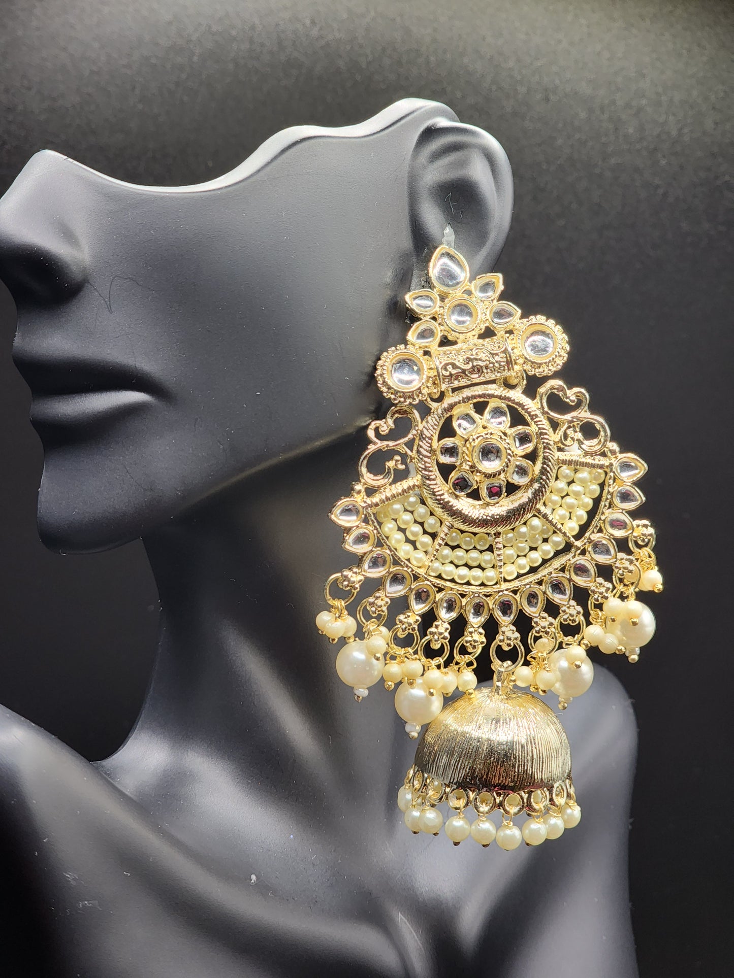 Bold, vibrant, and made to stand out. It's got rich enamel, intricate gold-tone work, and layered bead drops, this piece is desi