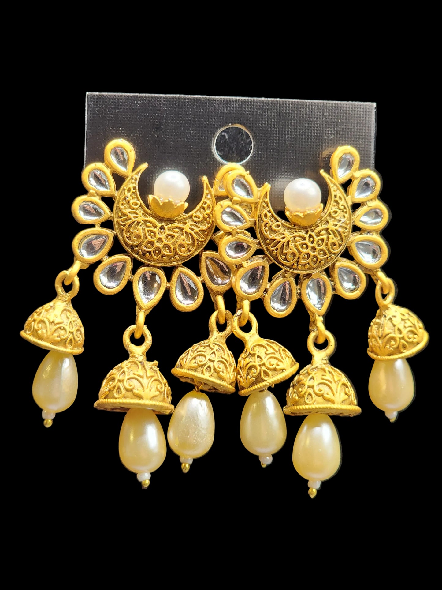 Bold, vibrant, and made to stand out. It's got rich enamel, intricate gold-tone work, and layered bead drops, this piece is desi