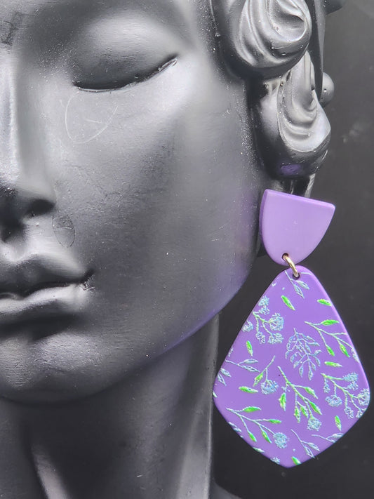 These lavender floral statement earrings are the perfect touch of elegance for any outfit.