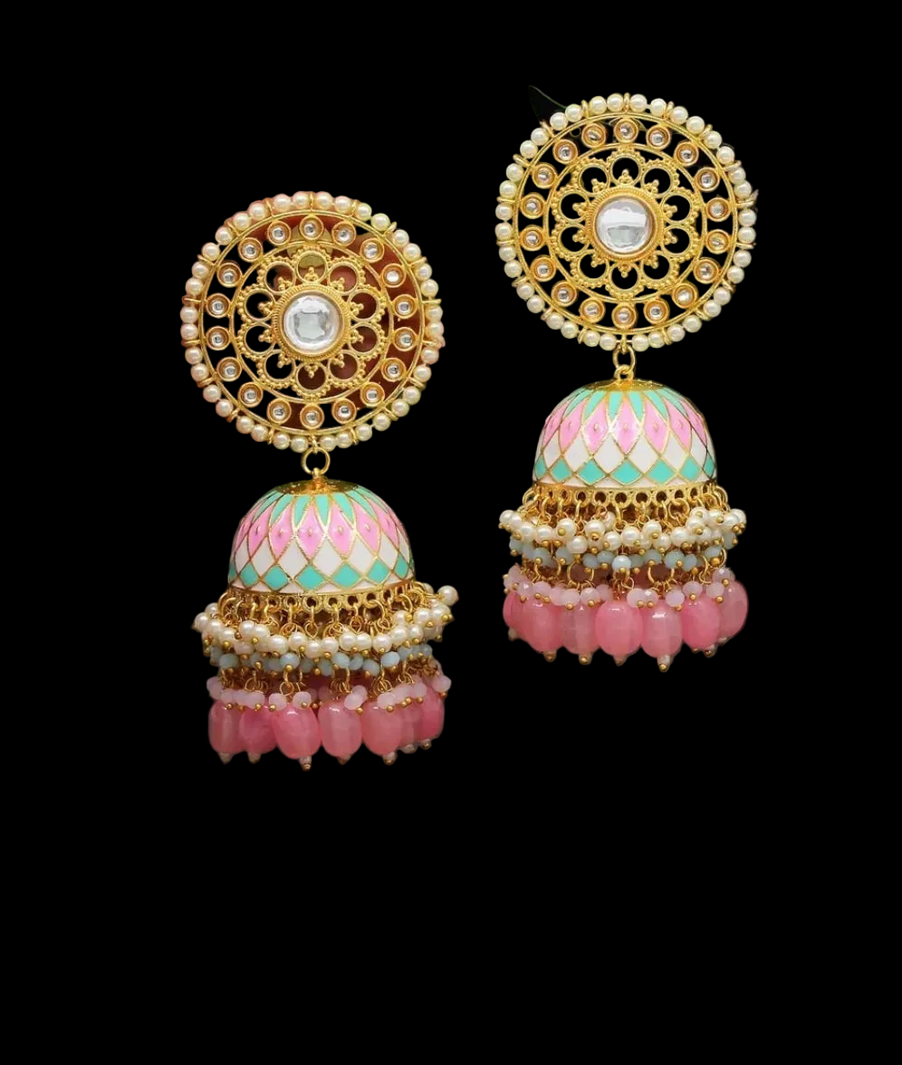 Bold, vibrant, and made to stand out. It's got rich enamel, intricate gold-tone work, and layered bead drops, this piece is desi