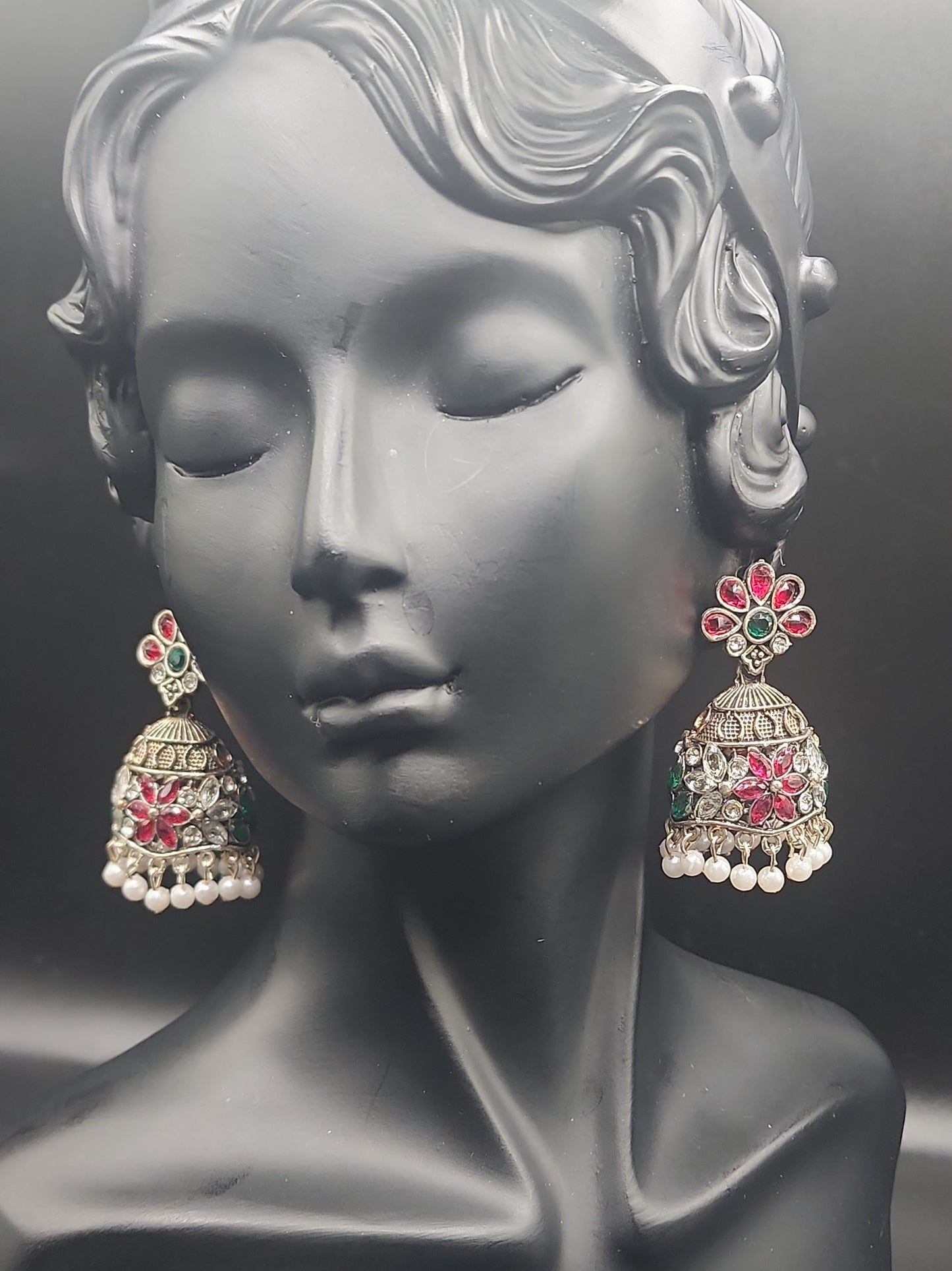 Handcrafted jhumkas featuring rich ruby tones, emerald accents, and delicate pearl drops ❤️