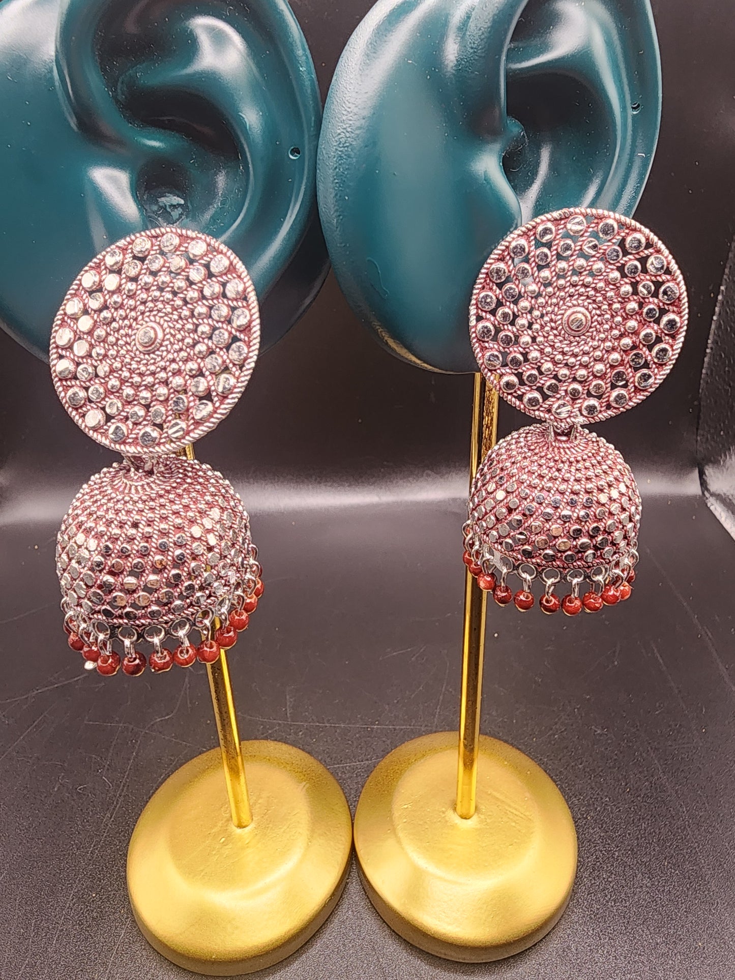PSK ELEGANCE Silver Jhumka Earrings with Red Bead Detailing