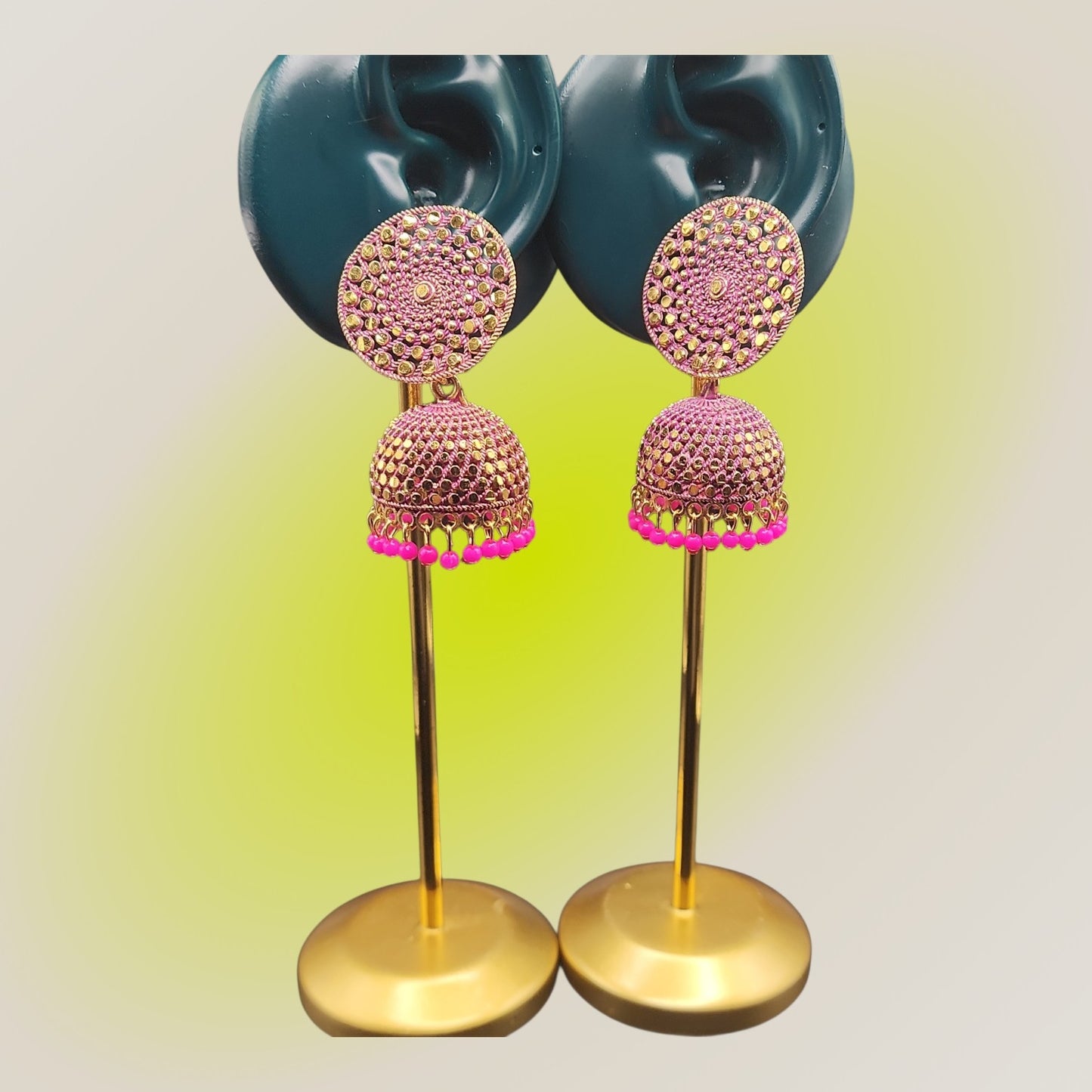 PSK ELEGANCE Gold Jhumka Earrings with Pink Bead Detailing
