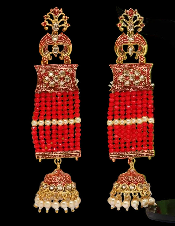 Bold, vibrant, and made to stand out. It's got rich enamel, intricate gold-tone work, and layered bead drops, this piece is desi