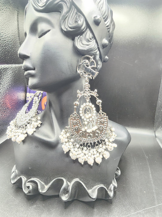 Intricate oxidized design Elegant pearl drop finishBold traditional + modern fusion