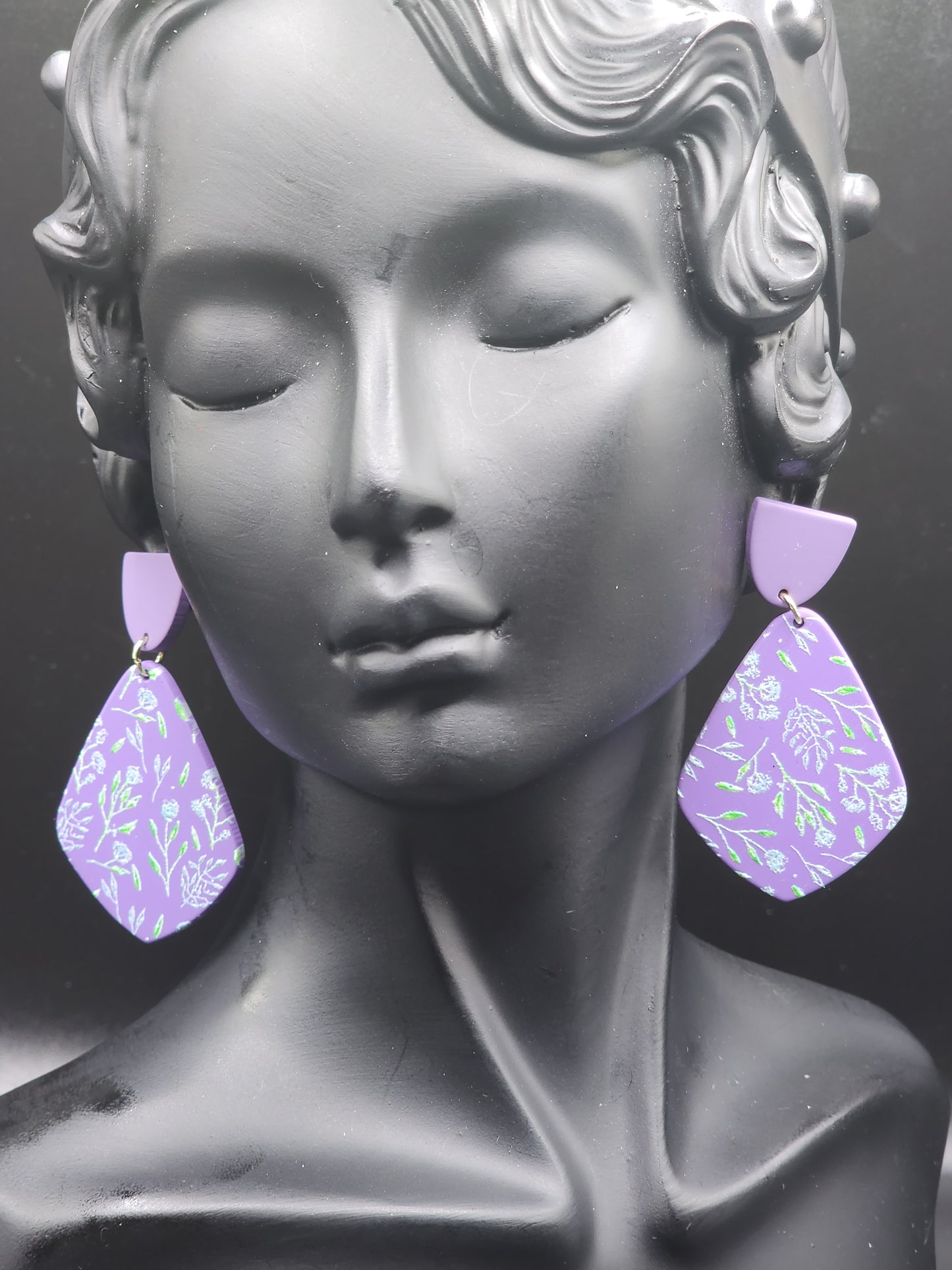 These lavender floral statement earrings are the perfect touch of elegance for any outfit.
