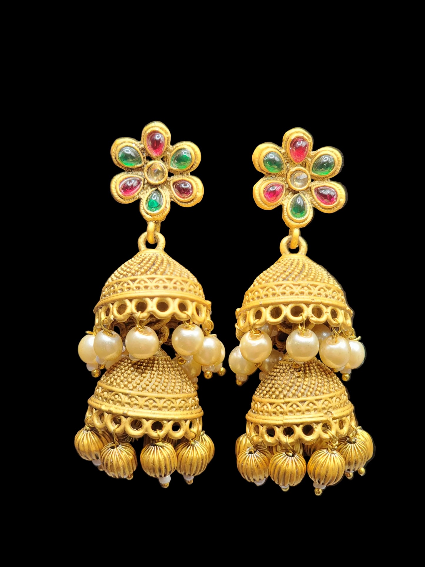 Bold, vibrant, and made to stand out. It's got rich enamel, intricate gold-tone work, and layered bead drops, this piece is desi