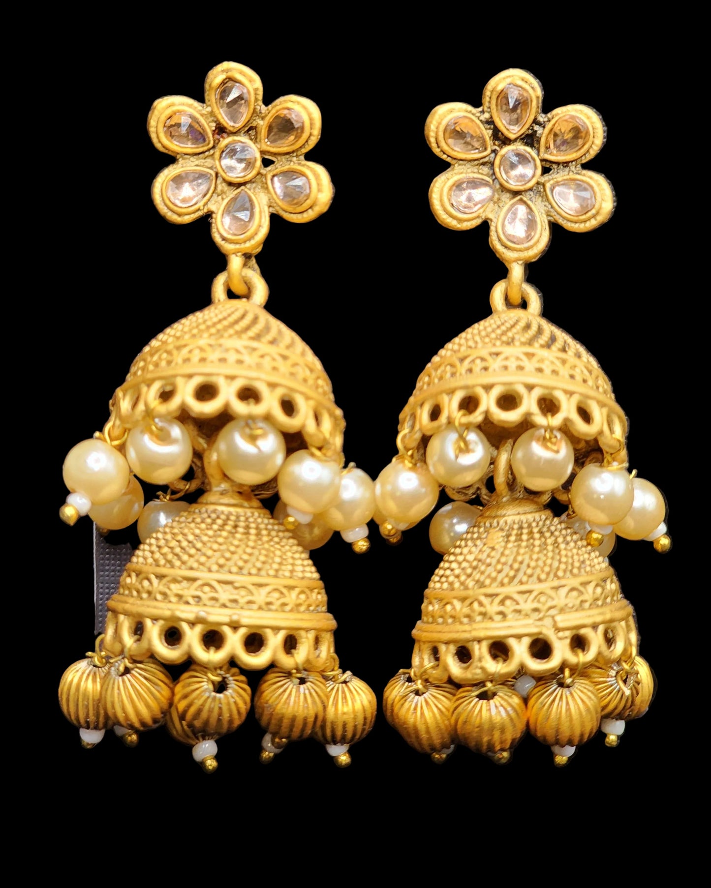 Bold, vibrant, and made to stand out. It's got rich enamel, intricate gold-tone work, and layered bead drops, this piece is desi