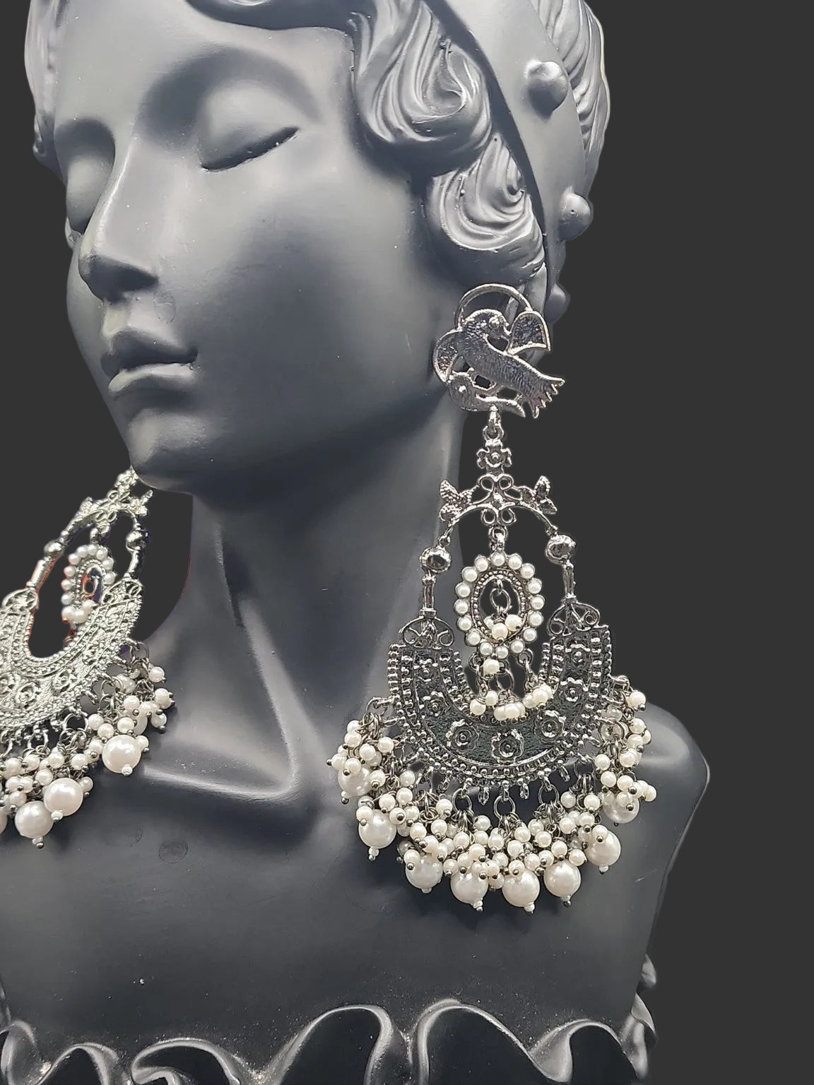Intricate oxidized design Elegant pearl drop finishBold traditional + modern fusion