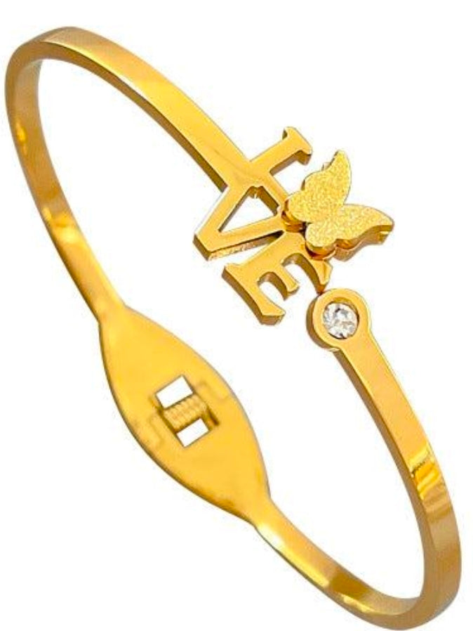 Celebrate love and elegance with the Gold-Tone LOVE Butterfly Crystal Bangle from PSK ELEGANCE.