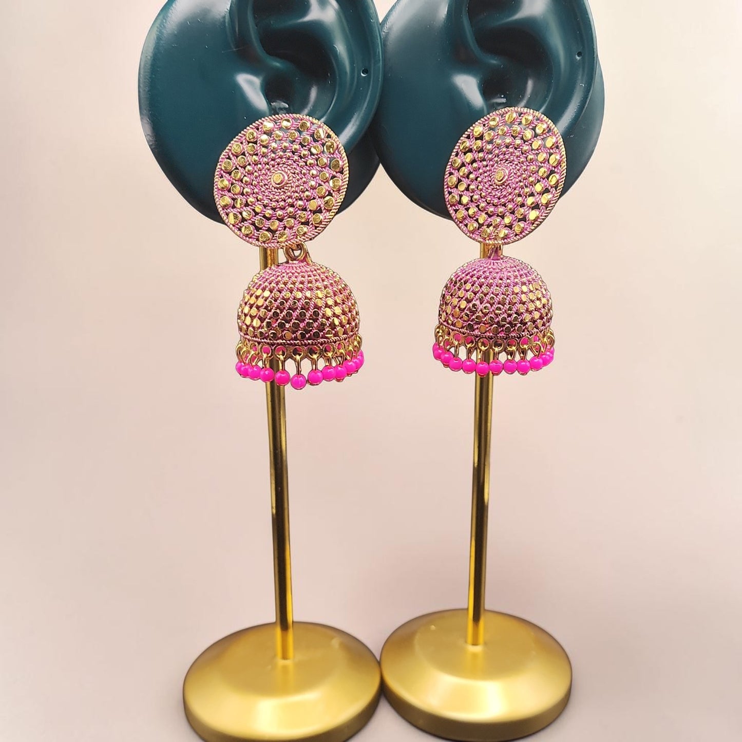 PSK ELEGANCE Gold Jhumka Earrings with Pink Bead Detailing