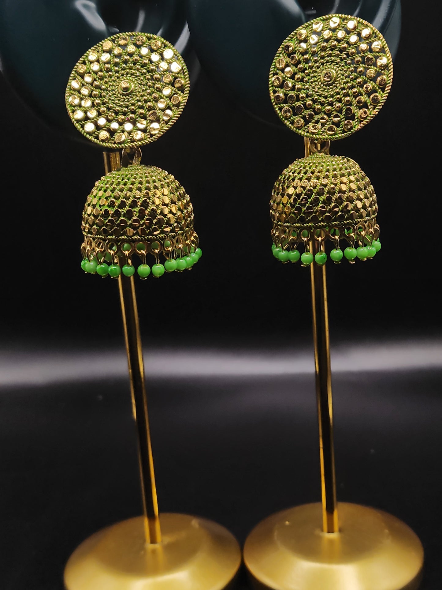 PSK ELEGANCE Gold Jhumka Earrings with Green Bead Detailing