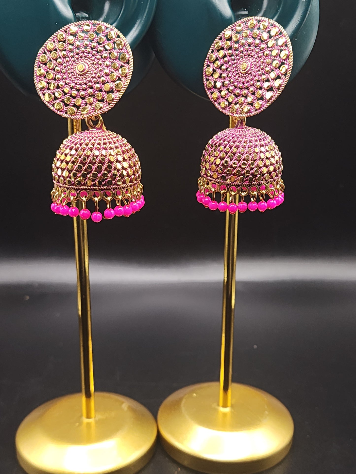 PSK ELEGANCE Gold Jhumka Earrings with Pink Bead Detailing